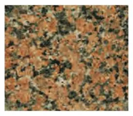 Speckled stone in orange and green tones.