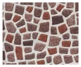 Mosaic tiling in irregular red pieces.