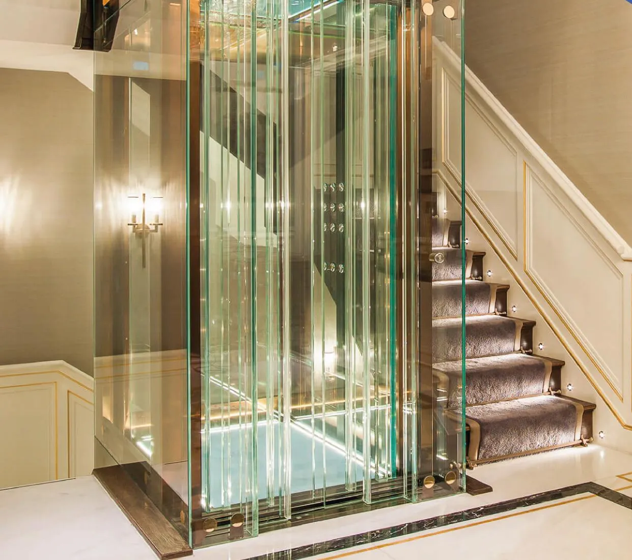 A glass elevator car inside a villa